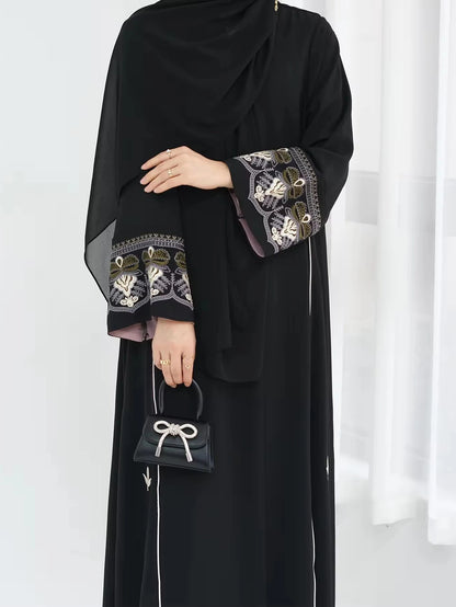Middle East Style Muslim Kaftan Black Fabric Embroidered Sleeve Design White Line Accents for Gulf Region Modest Fashion Events