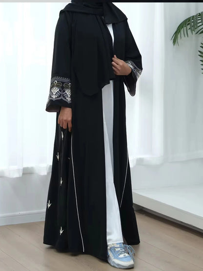 Middle East Style Muslim Kaftan Black Fabric Embroidered Sleeve Design White Line Accents for Gulf Region Modest Fashion Events