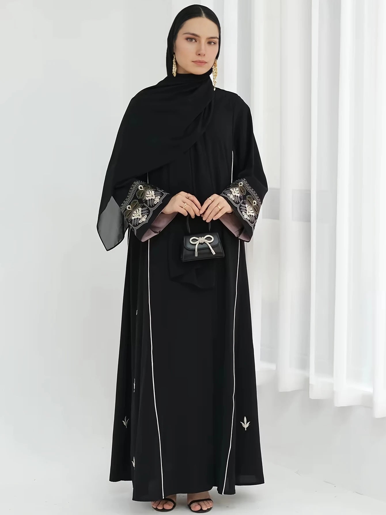 Middle East Style Muslim Kaftan Black Fabric Embroidered Sleeve Design White Line Accents for Gulf Region Modest Fashion Events