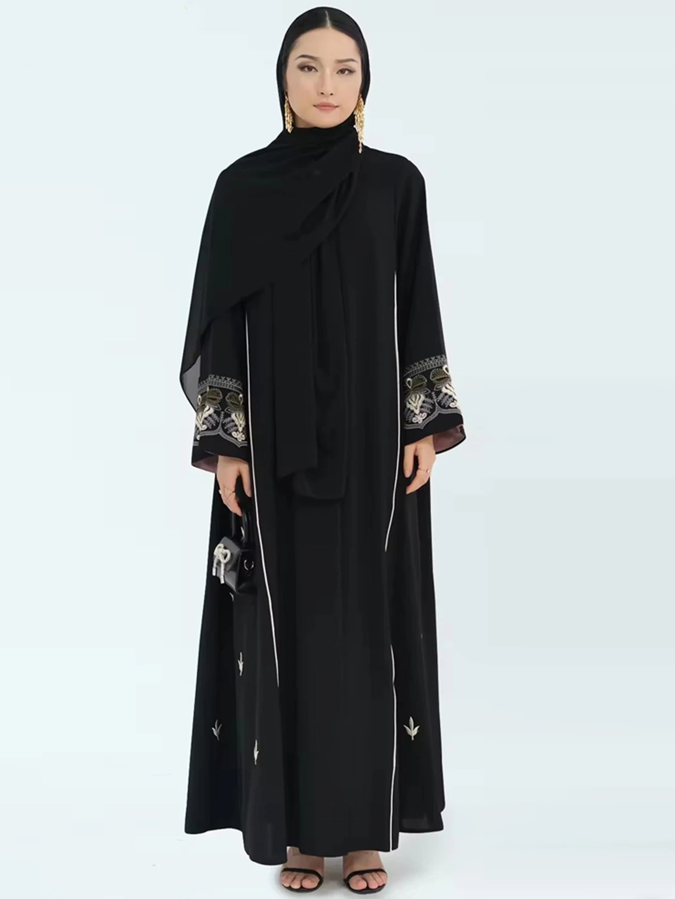 Middle East Style Muslim Kaftan Black Fabric Embroidered Sleeve Design White Line Accents for Gulf Region Modest Fashion Events
