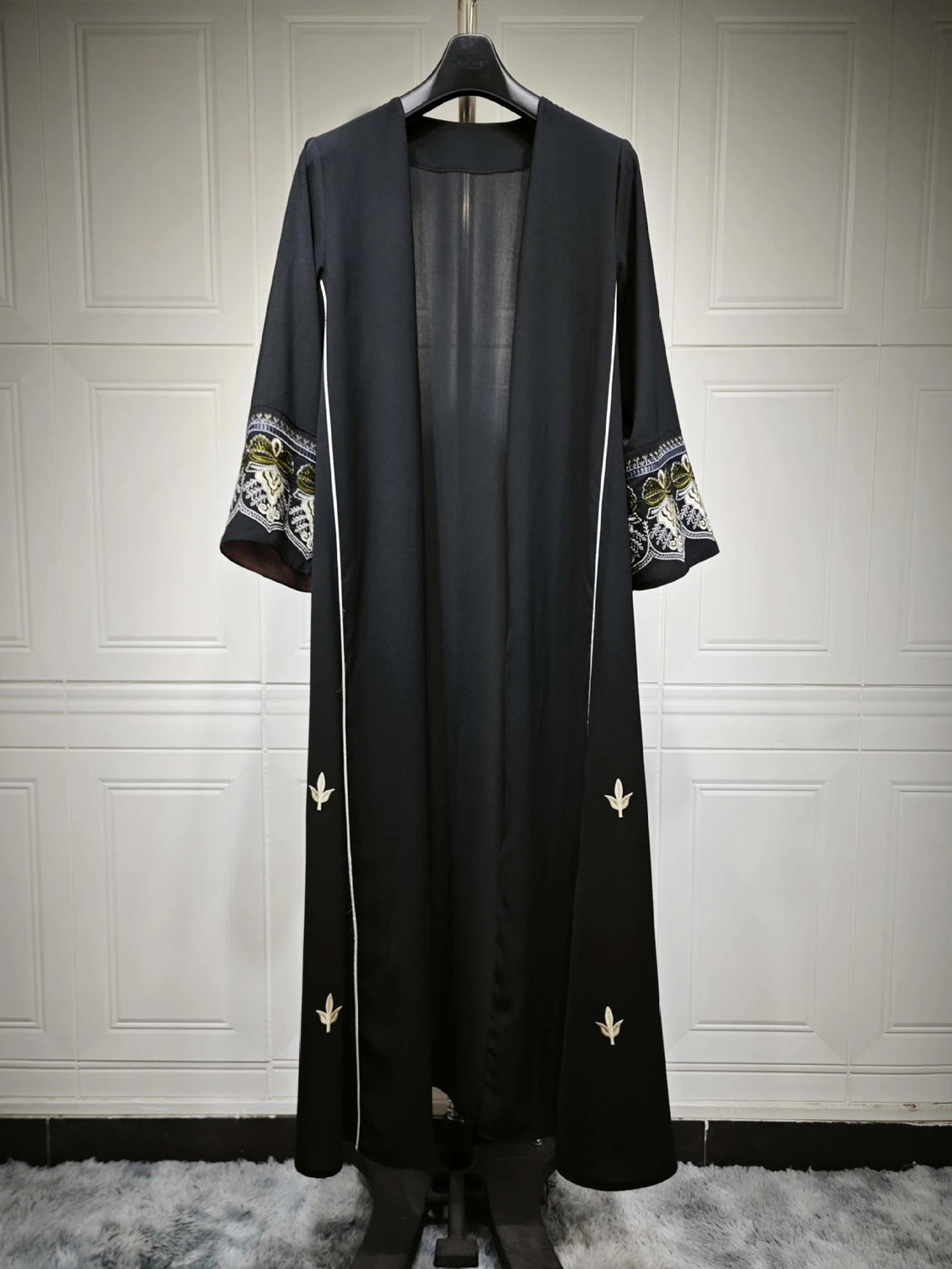 Middle East Style Muslim Kaftan Black Fabric Embroidered Sleeve Design White Line Accents for Gulf Region Modest Fashion Events
