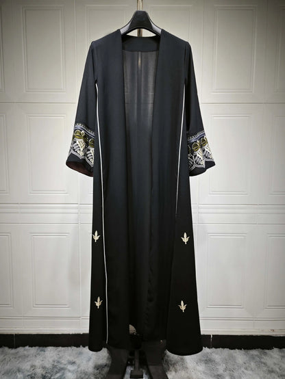 Middle East Style Muslim Kaftan Black Fabric Embroidered Sleeve Design White Line Accents for Gulf Region Modest Fashion Events
